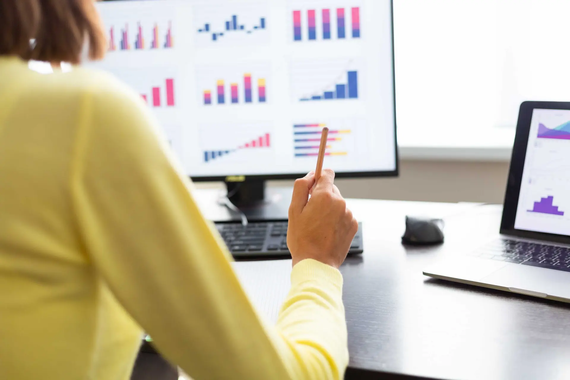 Professional analyzing Microsoft Dynamics 365 performance dashboards to improve forecast accuracy and data quality with guidance from Dynamics Monk.